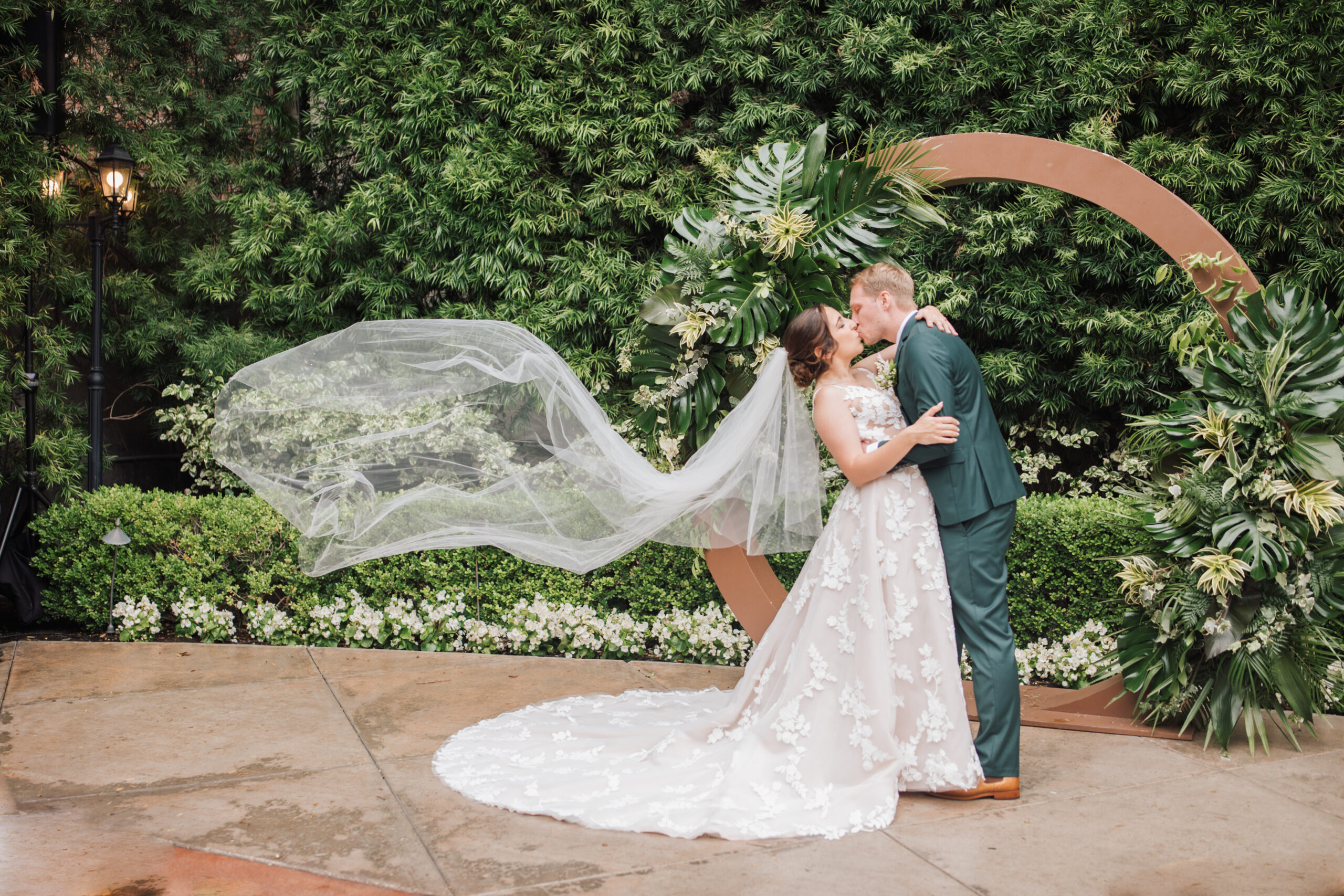 Franciscan Gardens Wedding bride and groom kissing